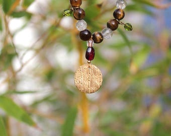 Kobo Daishi Necklace: wood beads, gold, Garnet, rutilated quartz, charm gold