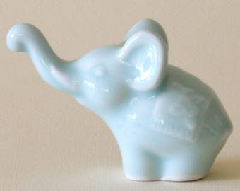 Whimsical Celadon Porcelain Elephant Figurine