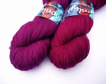 Yarn sock weight Hand dyed 100% Superwash Merino- raspberry plum (right)