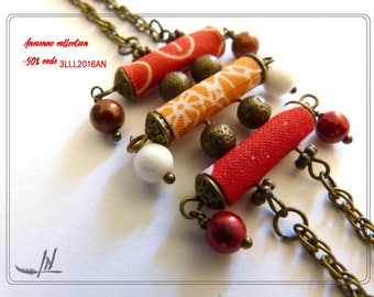 Bracelet in textiles and beads metal bronze.