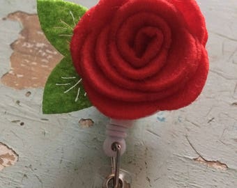 Red rose flower ID badge reel holder retractable clip