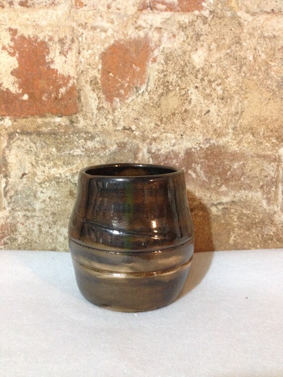 Bronze coloured mug or vase