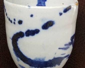 Handmade, wheel thrown, ceramic pottery juice cup.