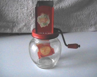 Vintage 1940's Hazel Atlas nut grinder with orange on the spout