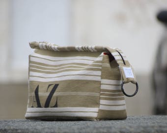 Khaki and white striped mattress ticking bag lined with red cotton