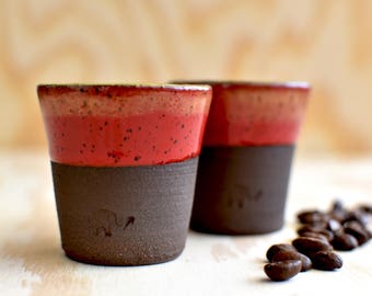 One set of two red espresso cups, elephant