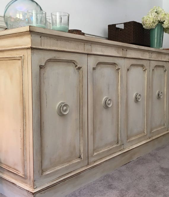 Antiqued ivory buffet entertainment center
