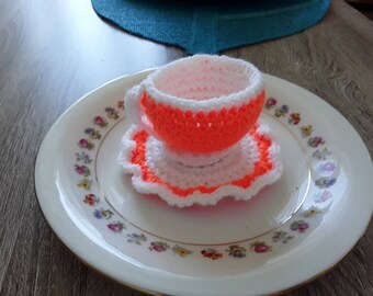 Cup and saucer with hand made crochet
