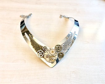 Asymetric steampunk necklace with cogs, old watch mecanism and angel wings