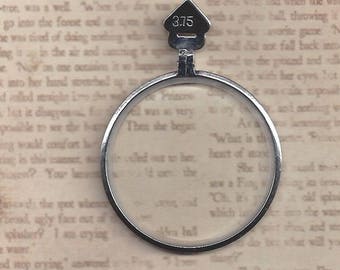 Birdhouse Style tab on a Trial Optical Lens or Monocle lens