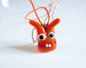 Orange Monster necklace with polymer clay