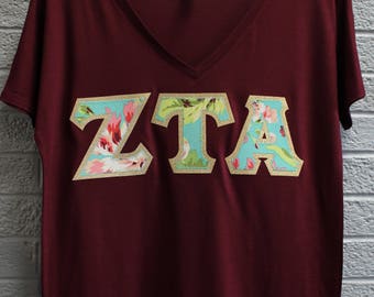 Zeta Tau Alpha Maroon Bella Flowy V-Neck With Amy Butler Bliss Bouquet on Gold Metallic (254C)