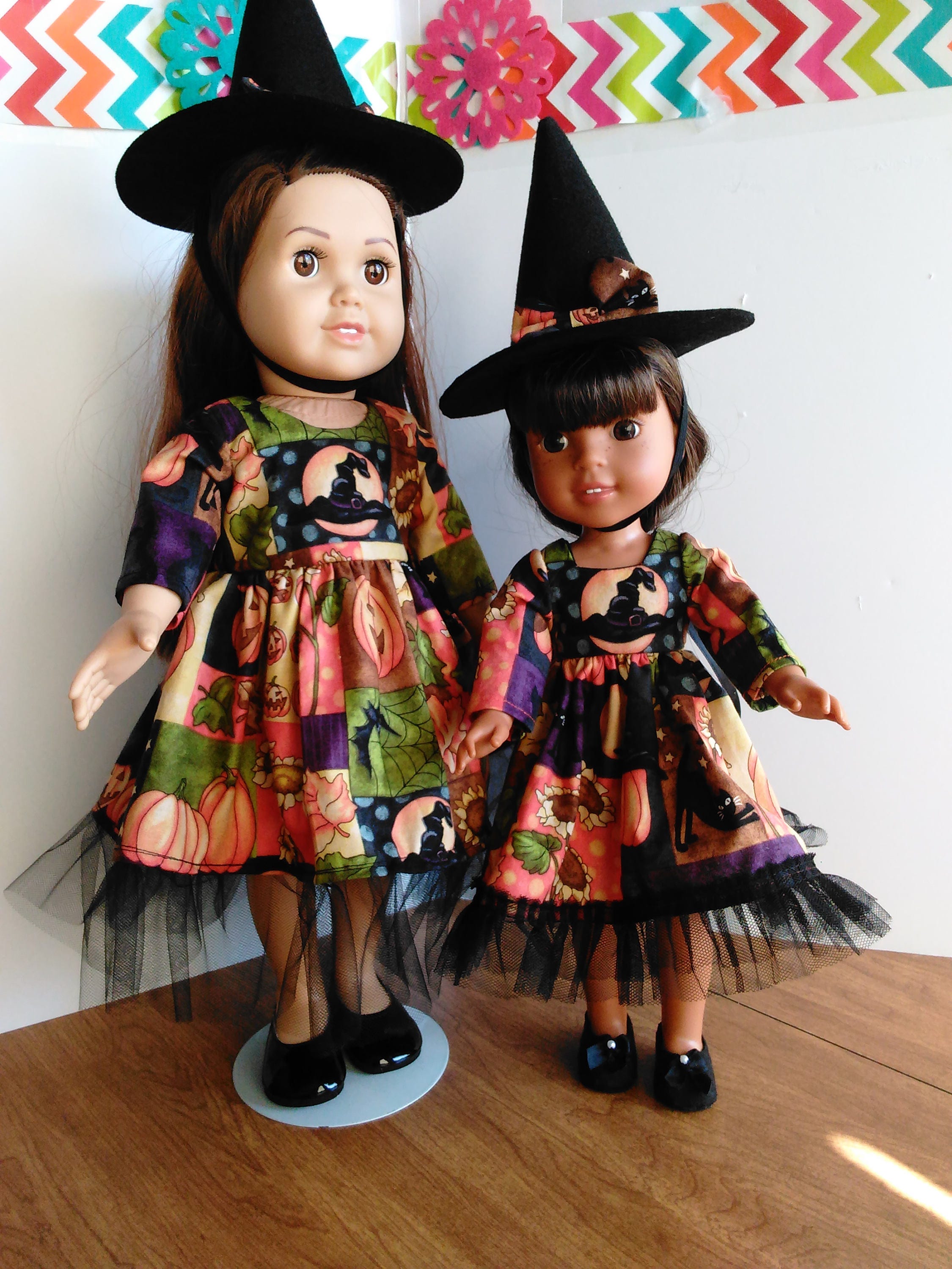 Big sister little sister matching Halloween dresses and witch