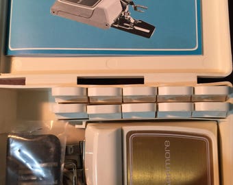 Vintage Kenmore Sewing Machine Buttonhole attachment Model #42231 with instruction book in White plastic case
