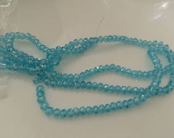 A 3 mm blue faceted Crystal bead