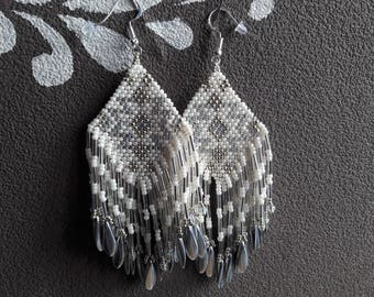 Pair of earrings in Peyote Amedindien spirit.