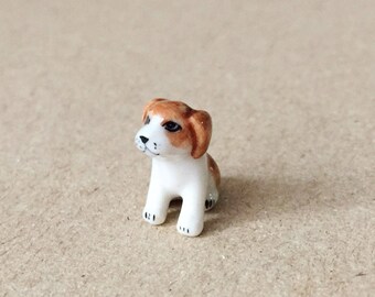 Brown and white puppy tiny ceramic - size 1.4cm.x1.6cm. - Made of ceramic and painting