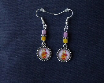 Matryoshka earrings orange background light purple