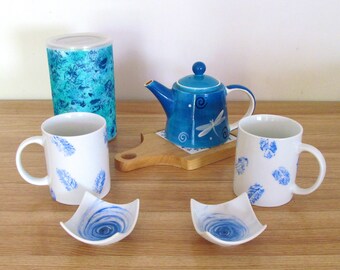 Matching set of two mugs with their cups