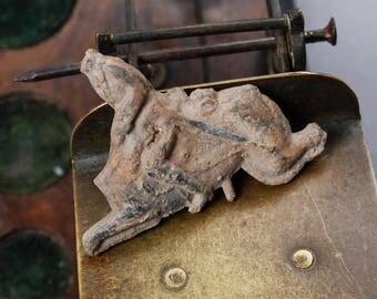 Antique lead toy, figurine man riding a horse. "headless horseman"