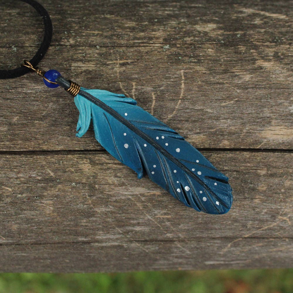 Image result for necklace that made of blue bird feather