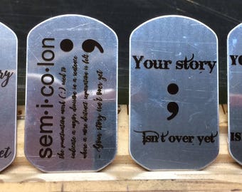 Laser-engraved Project Semicolon necklaces