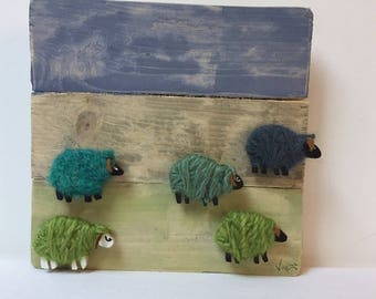 Made of wood and dressed in wool sheep