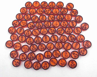 Vintage 1970s Orange and Black Plastic Bingo Game Pieces with Numbers and Letters Set of 74