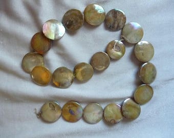 Beads, 16-18mm Flat Round Coin, Mother of Pearl, Shades of Gold, Very Shiny. Sold per 15 inch strand. There are 20 beads on the strand.