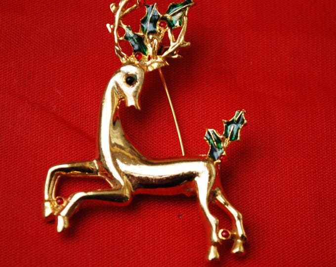 Vintage Christmas Reindeer Brooch Gold tone with red rhinestones and green enamel Holly Holiday Pin