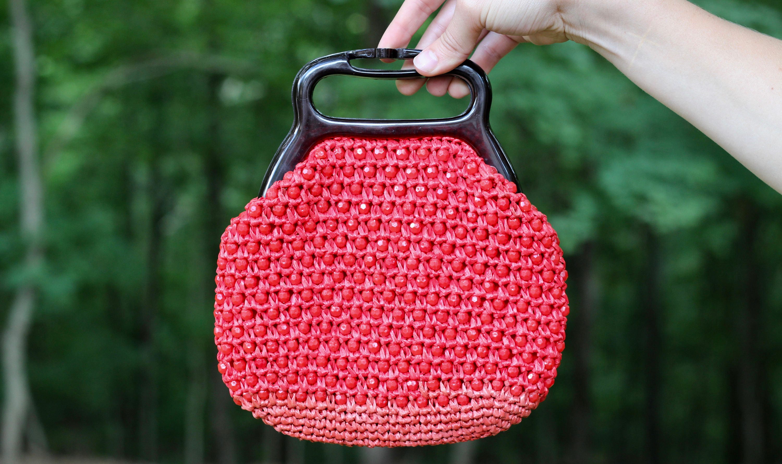 red raffia bag