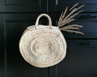 Oval round basket with palm leaves, round basket, basket bag.