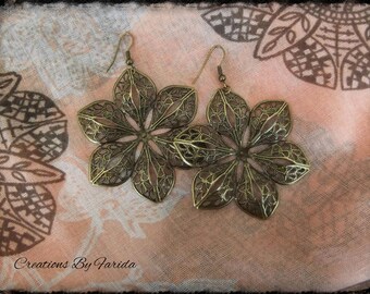 Bronze earrings dangle a 6 petal flower
