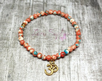 Pearl bracelet orange/green/white with Golden OM pendant