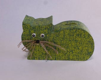 The scroll saw-cut wooden cat piggy bank