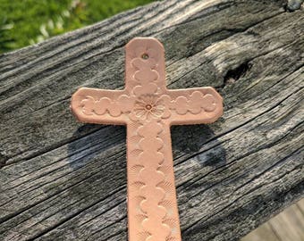 Hand stamped leather cross.