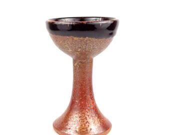 Goblet, wine glass or chalice in shiny black and copper brown