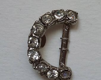 2 BELT BUCKLES IN RHINESTONES ON METAL SILVER IN THE SHAPE OF C.