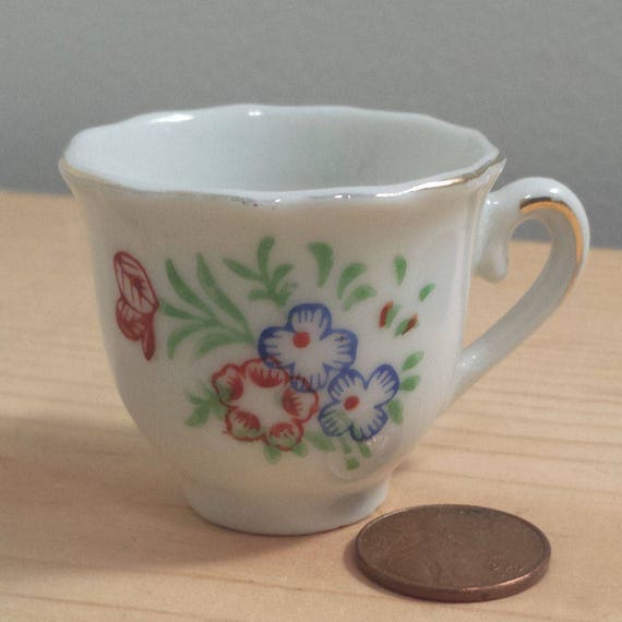 Porcelain vintage Miniature Teacup and Saucer with Red and