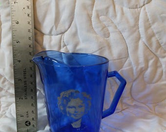 Shirley Temple, Sapphire blue or Cobalt blue, milk pitcher, creamer, chipped, Captain January costume, Hazel Atlas Glass Co produced 1936-42