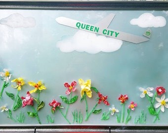 24x36 plastic bottles flowers on plexiglass pane.