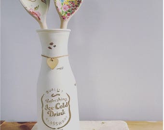 Hand painted vase with any two spoons.