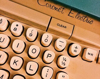 Vintage 1964 Smith-Corona Coronet Electric Portable Typewriter, with lock-in carrying case. Blue/Teal colors.
