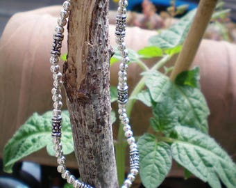 beaded bracelet and silver color charm