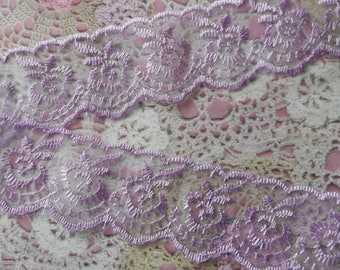 Purple lace scalloped on 2 sides and intricately embroidered flowers polyester 4,00 cm width