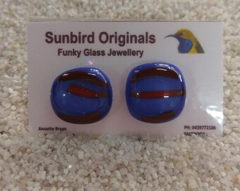 Blue glass stud earrings with fun red highlights
