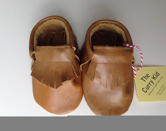 Handmade leather moccasins in toffee
