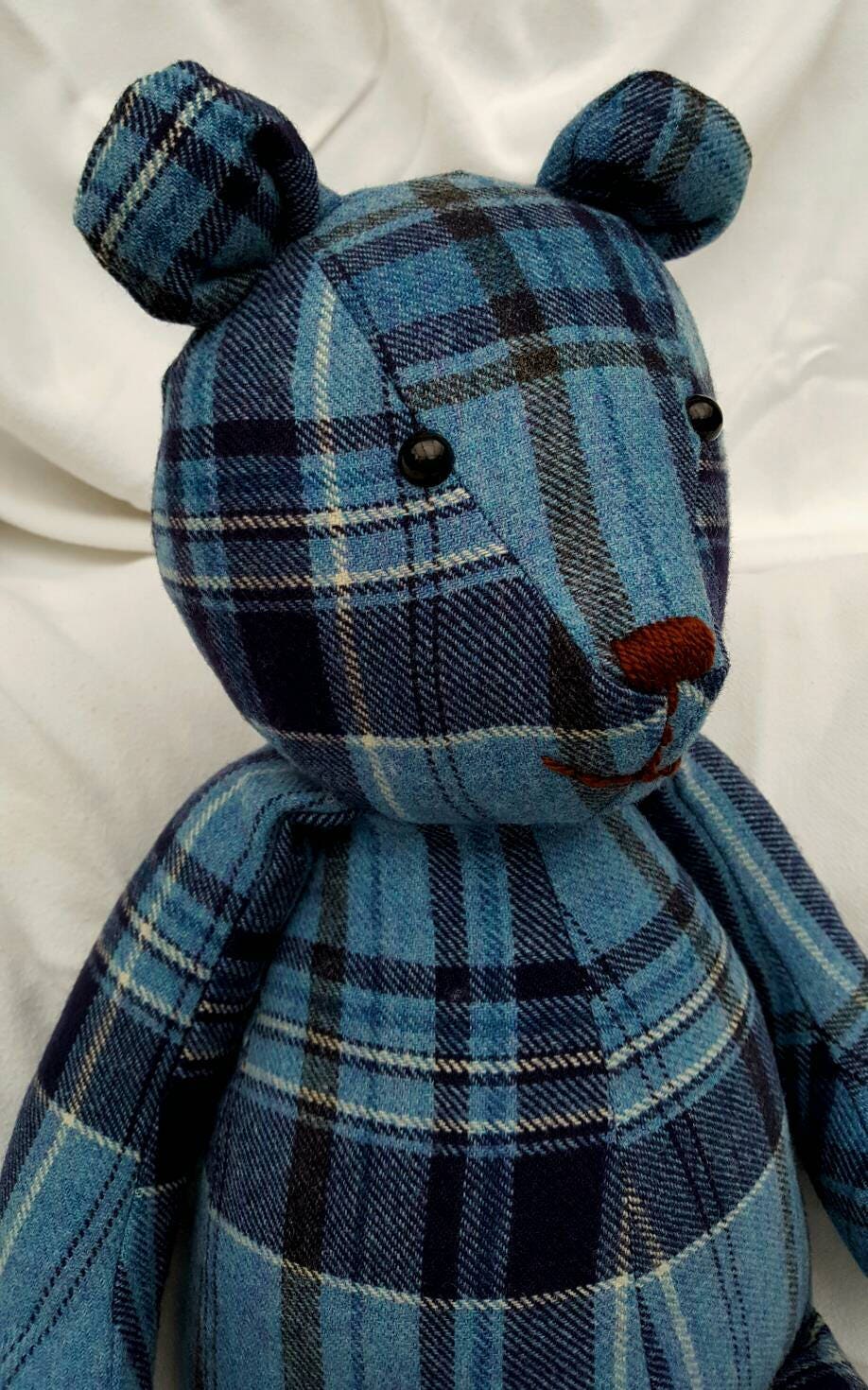 teddy bear wearing a kilt