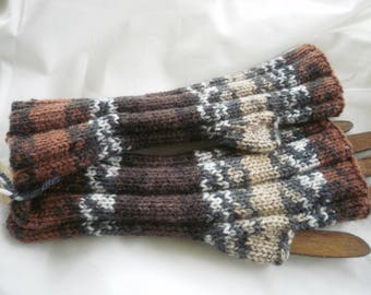 Knitted mittens handmade in a changing in different shades of beige and Brown yarn