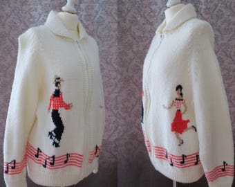 Vintage white hand knitted cowichan cardigan with dancers and musical notes